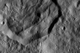 This image, which was taken by NASA's Dawn probe on Dec. 19 from a distance of 240 miles (385 kilometers), shows the 25-mile-wide (40 km) Messor Crater.