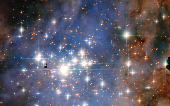 This NASA/ESA Hubble Space Telescope image features the star cluster Trumpler 14. One of the largest gatherings of hot, massive and bright stars in the Milky Way, this cluster houses some of the most luminous stars in our entire galaxy.