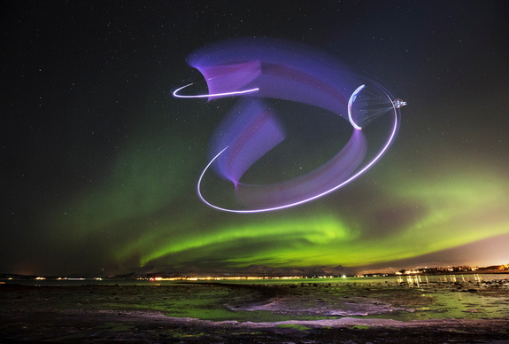 In this stunning long-exposure view, paraglider Horacio Llorens creates light streaks with green auroras in the background during a flight in Tromsø, Norway, on Jan. 13, 2016.