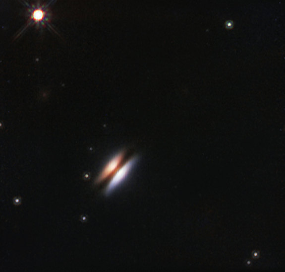 The Hubble Space Telescope captured this infrared view of the young star 2MASS J16281370-2431391, which is surrounded by a disk of gas and dust that has been nicknamed the Flying Saucer.