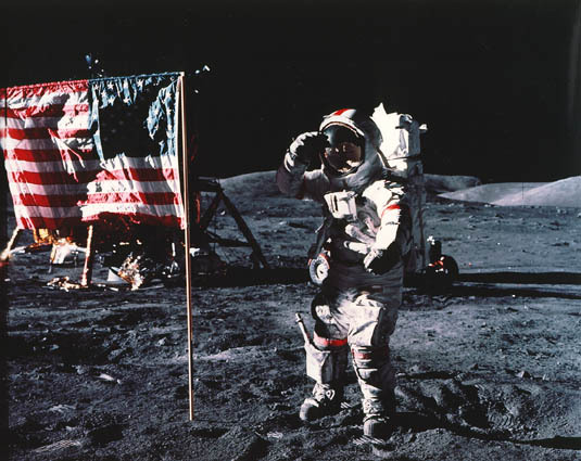 Astronaut Gene Cernan, Apollo 17 commander, salutes the deployed United States flag on the lunar surface. Cernan is the subject of the documentary, "Last Man on the Moon." 