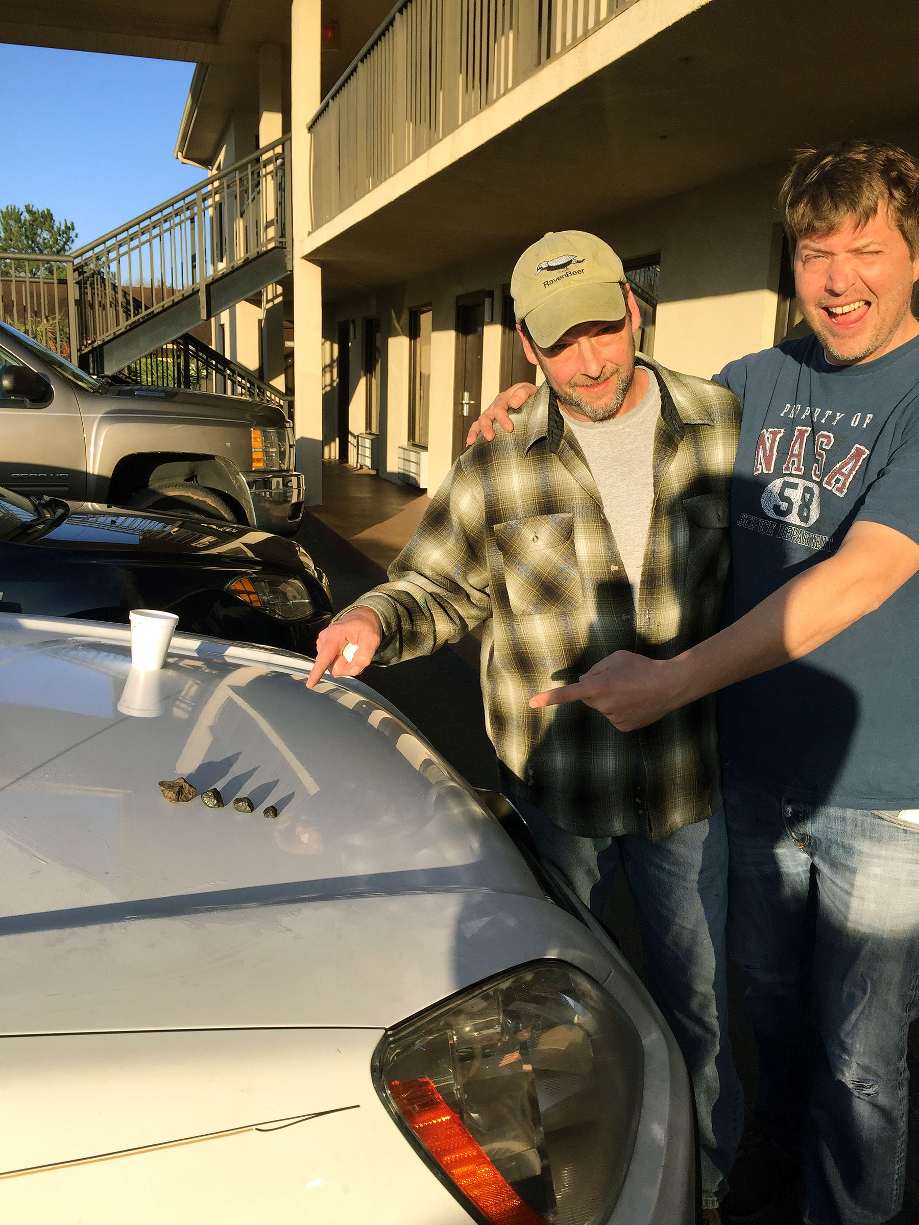 Larry Atkins and Mike Hankey with Four Meteorites