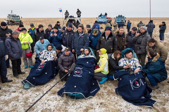 NASA astronaut Scott Kelly (right) and Russian cosmonauts Mikhail Kornienko and Sergey Volkov are seen in good spirits after their March 2, 2016 landing in a remote area near the town of Zhezkazgan, Kazakhstan (March 1 Eastern Time) to end a 340-day flight for Kelly and Kornienko.
