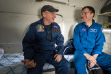NASA astronaut Scott Kelly left, talks with NASA flight surgeon Steve Gilmore onboard a Russian MI-8 helicopter at Zhezkazgan Airport in Kazakhstan after Kelly and cosmonauts Sergey Volkov and Mikhail Kornienko landed on March 1, 2016.