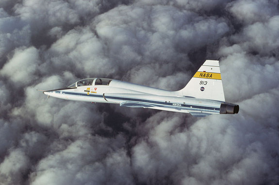 NASA’s T-38 jet, tail no. 913, is seen in chase of the Shuttle Carrier Aircraft mated with the orbiter Enterprise in 1977. The same jet is going on display with the prototype shuttle at the Intrepid Sea, Air and Space Museum in New York City. 