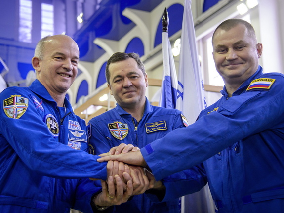 American astronaut Jeff Williams and Russian cosmonauts Oleg Skripochka and Alexei Ovchinin launched to the International Space Station March 18 from the Baikonur Cosmodrome in Kazakhstan. Here, they posed before their Soyuz qualification exams Feb. 24.