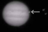 The flash from a new impact on Jupiter (arrow) is seen in this still from a video taken through a telescope by amateur astronomer John McKeon of Swords, Ireland on March 17, 2016.
