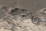 Mountains covered with carbon-dioxide frost surround the outer edges of the Argyre basin in this image captured by NASA's Mars Global Surveyor image.