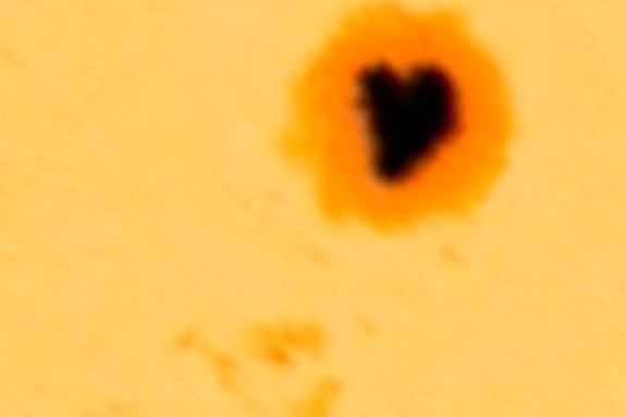 The sun has a giant heart-shaped sunspot called Active Region 2529 that is currently facing Earth, as seen in this image from NASA's Solar Dynamics Observatory.