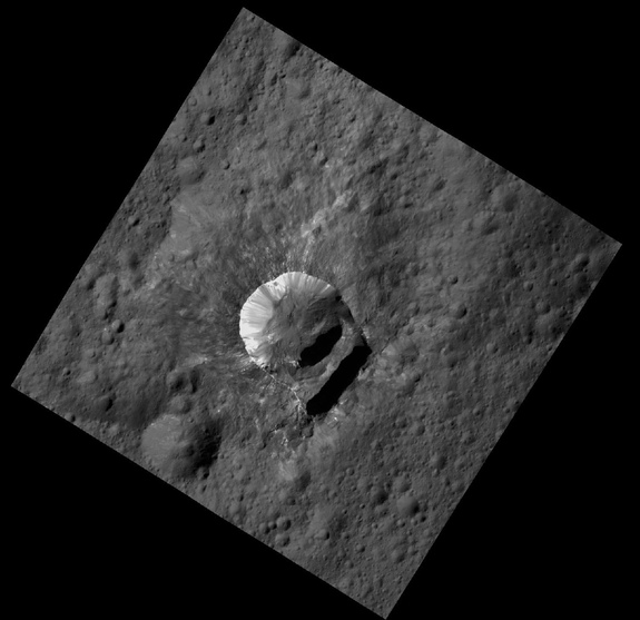 NASA's Dawn spacecraft captured this view of Ceres’ 6-mile-wide (10 kilometers) Oxo Crater from an altitude of 240 miles (385 km). The crater possesses an unusually large "slump" in its crater rim. Image released April 19, 2016.