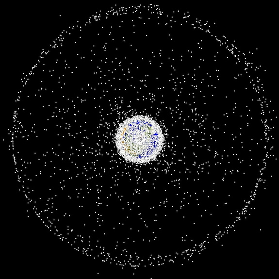 Space debris is a growing problem for machines and humans in space. This image shows large pieces of space debris orbiting the Earth (the size of the objects are enlarged). Even very small bits of space debris (micrometeoroids) can cause damage.