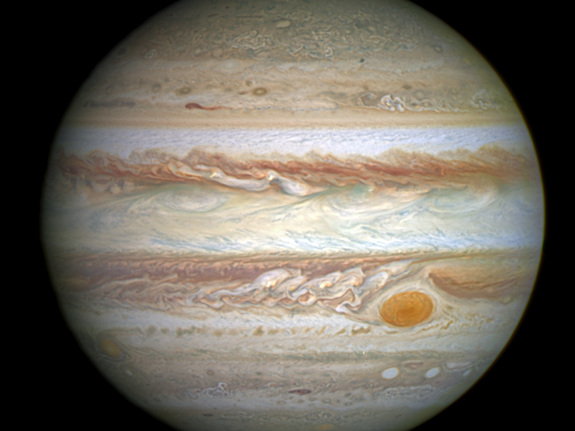 This spectacular image by NASA's Hubble Space Telescope shows Jupiter's trademark Great Red Spot — a swirling storm larger than Earth.