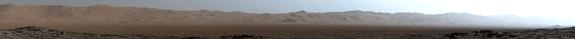 This early-morning view from the Mastcam on NASA's Curiosity Mars rover on March 16, 2016, covers a portion of the inner wall of Gale Crater. At right, the image fades into glare of the rising sun.