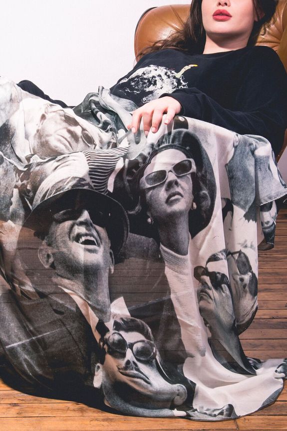 This scarf, made by Slow Factory, calls viewers to relive the excitement of the Apollo 11 liftoff with a photo of amazed faces watching the craft launch.