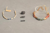 Ancient iron beads (center) excavated from an Egyptian tomb in 1911 were made from iron meteorites.
