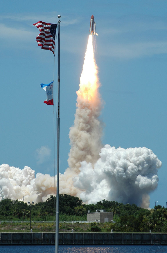 The space shuttle Discovery lifts off on mission STS-121 from NASA’s Kennedy Space Center in Florida on July 4, 2006, marking the first and only time in the program’s history that a launch occurred on Independence Day.