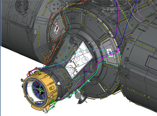An illustration of the IDA-2 attached to the side of the International Space Station. The adapter will let piloted and automatic spacecraft easily dock at the standardized port, without extra help from space station astronauts.