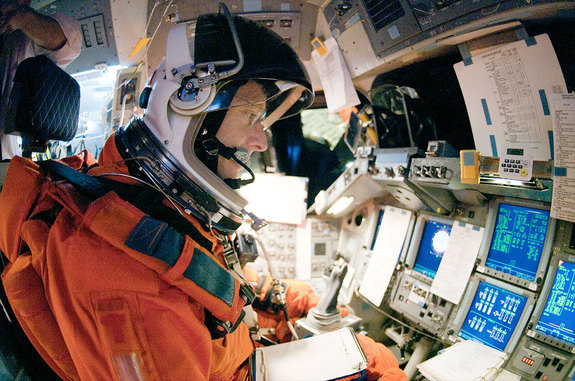 STS-135 commander Chris Ferguson trains to fly on the last space shuttle mission inside the fixed base simulator.