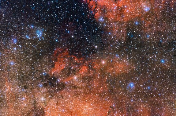 The bright blue stars of the Messier 18 cluster are captured in the upper left of this new image taken by the European Southern Observatory's Very Large Telescope. Messier 18 is known as an open cluster because it contains young, loosely-packed stars.