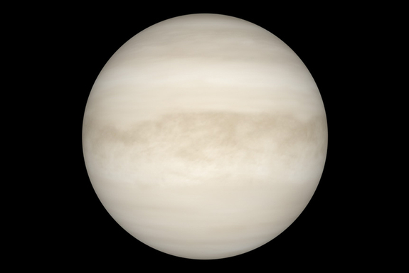 A perspective of Venus with manifest light reveals a smooth, white sphere. The light can't dig a planet's thick cloud layer.