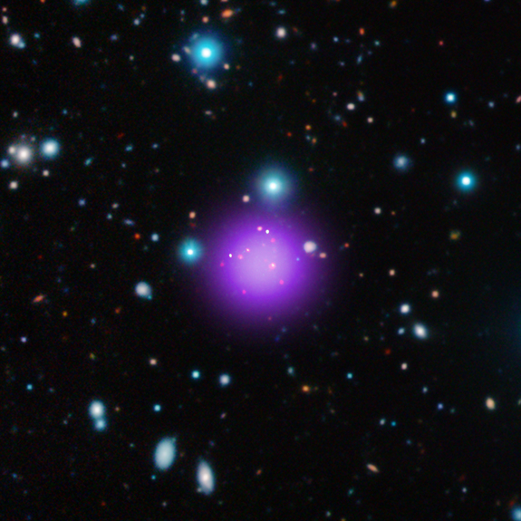 Galaxy cluster CL J1001+0220 is the most distant cluster ever discovered. This image is a composite of X-ray, infrared and radio observations from several telescopes.