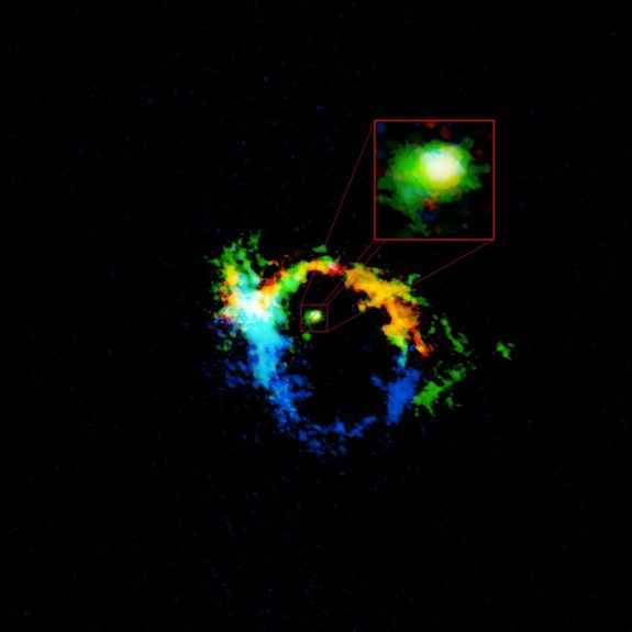 ALMA image of the central region of galaxy NGC 1068. The torus of material harboring the supermassive black hole is highlighted in the pullout box. This region, which is approximately 40 light-years across, is the result of material flung out of the black hole's accretion disk.