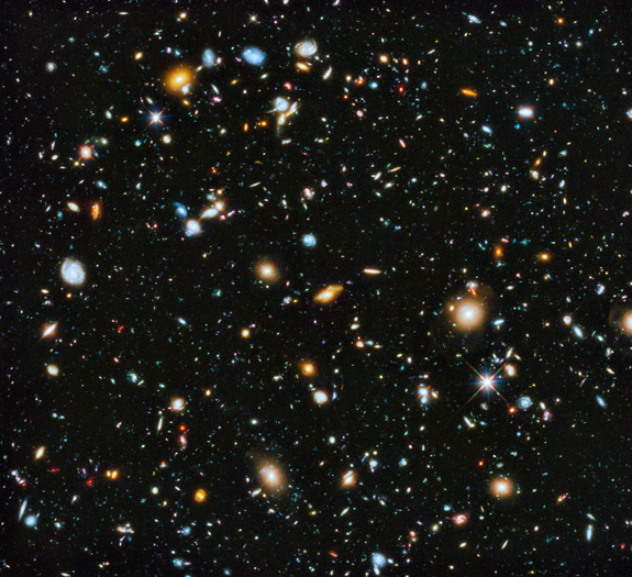 The Hubble Space Telescope accumulated approximately 555 hours of exposure time to capture this Hubble eXtreme Deep Field image. The area shown represents a seemingly empty patch of sky about the width of a toothpick when held at arm's length. The picture contains only two foreground stars (indicated by surrounding spikes). Every other object is a galaxy. The most distant galaxies' light is reddened by the expansion of the universe. We're seeing light that left them 13.2 billion years ago.