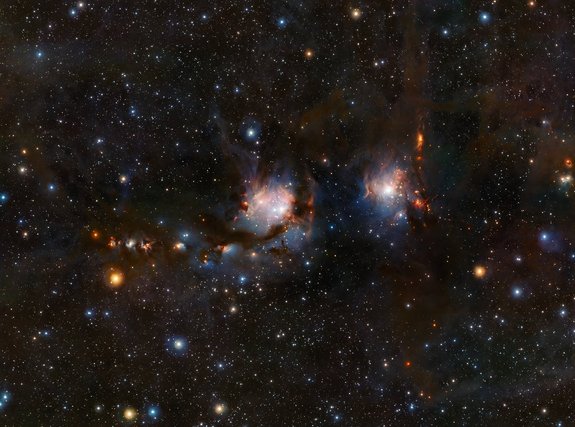 This new view of the star formation region Messier 78 (M78) was taken with the VISTA infrared survey telescope at ESO's Paranal Observatory in Chile. This image shows blue regions of light from the hot young stars, streams of dark dust, and red jets emerging from stars in the process of formation. M78 is the big blue region on the left; another nebula by the name of NGC 2071 is the smaller region on the right.