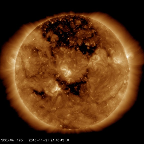 NASA's Solar Dynamics Observatory spacecraft captured this image of the sun's huge, dark coronal hole on Nov. 21, 2016.