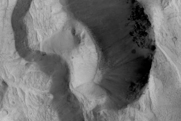 Fly Over Martian Chasms and Craters Through ExoMars Orbiter's Lens | Video