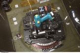 Don Pettit built this "barn door tracker" for the International Space Station's Destiny laboratory window from 2002-2003, using spare parts from around the station. During downtime, he could fit the whole assembly into the window and use the drill to smoothly move the camera across the sky, taking two or three photos of a city as it passed by.
