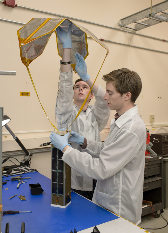 Engineers pack Exo-Brake into the Technical Education nanosatellite (TechEdSat-5), which traveled to the space station aboard the Japanese Aerospace Exploration Agency's robotic H-II Transfer Vehicle 6.