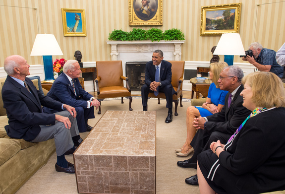President Barack Obama meets with Apollo 11 astronauts Michael Collins, seated left, Buzz Aldrin, Carol Armstrong, widow of Apollo 11 commander Neil Armstrong, NASA Administrator Charles Bolden, and Patricia “Pat” Falcone, OSTP Associate Director for National Security and International Affairs, far right, Tuesday, July 22, 2014, in the Oval Office of the White House in Washington, during the 45th anniversary week of the Apollo 11 lunar landing.