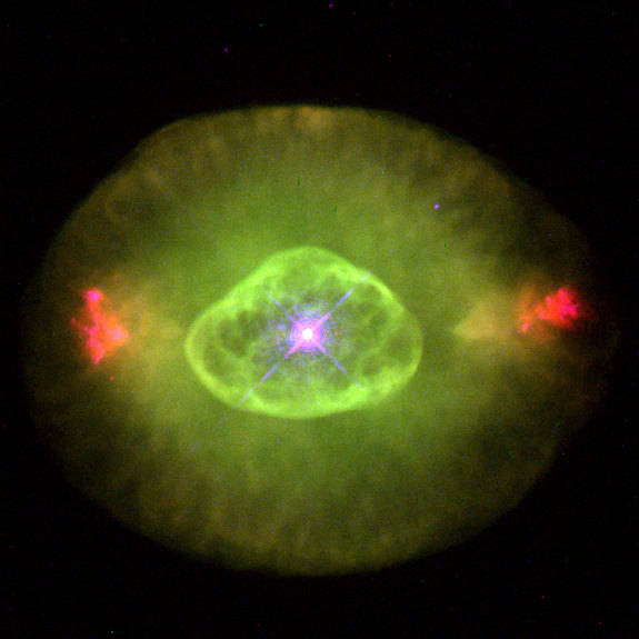 This image shows a planetary nebula — a very hot star near the end of its life. The greenish tint arises from the presence of oxygen atoms with two electrons removed.