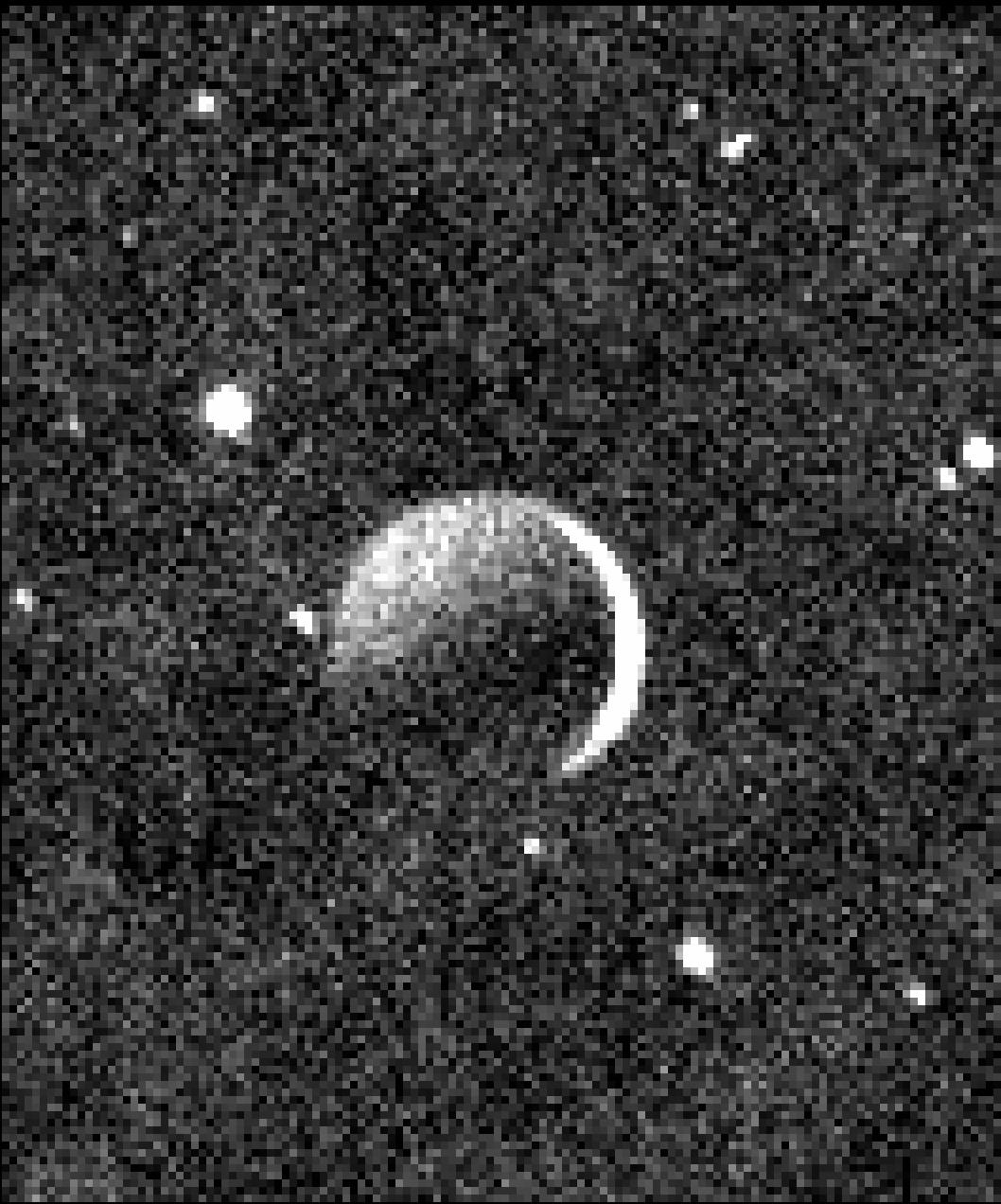 Moonshine Glow: See Pluto's Moon Charon as a Crescent in NASA Photo