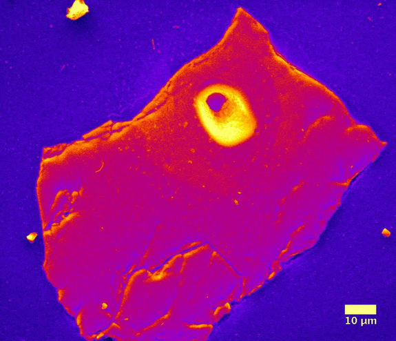 A false-color image taken by an electron microscope of a polished cross-section of chrome spinel. The mineral was taken from a fossil micrometeorite that likely came from the asteroid 4 Vesta.
