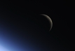 Douglas Wheelock takes a picture of the moon. 
