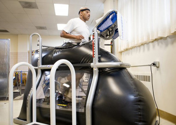 Retired Staff Sgt. Jesse Whitmier exercises in the NASA-developed
