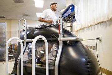 Retired Staff Sgt. Jesse Whitmier exercises in the NASA-developed 
