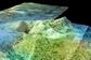 This topographic image shows an area of Saturn's moon Titan, known as Sotra Facula, which may harbor an ice volcano (cryovolcano). Finger-like flows suggest the presence of cryovolcanism. NASA's Cassini spacecraft collected data for this false-color image