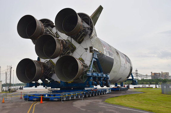 The last Saturn V S-IC stage, which would have flown on Apollo 19, nears the barge for its move to the Infinity Science Center in Mississippi.