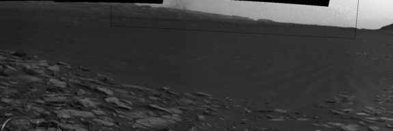 Beyond a dark sand dune closer to the rover, a Martian dust devil passes in front of the horizon in this sequence of images from NASA's Curiosity Mars rover. 